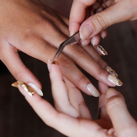 models gets a manicure backstage at creatures of comfort news photo 1660753727